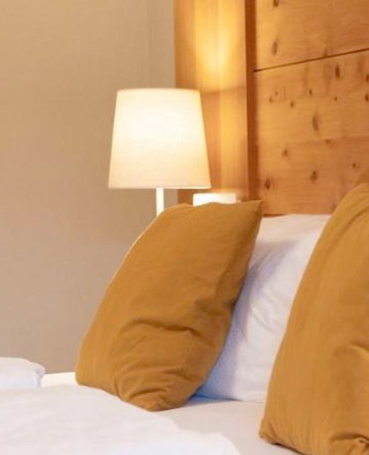 Gemütliches Doppelbett im Appartementhaus Apart Elisabeth